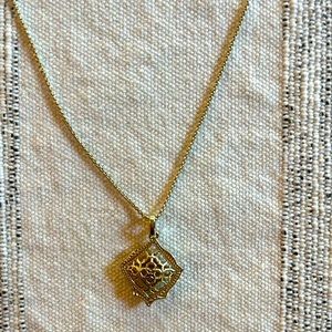 Kendra Scott gold necklace.
